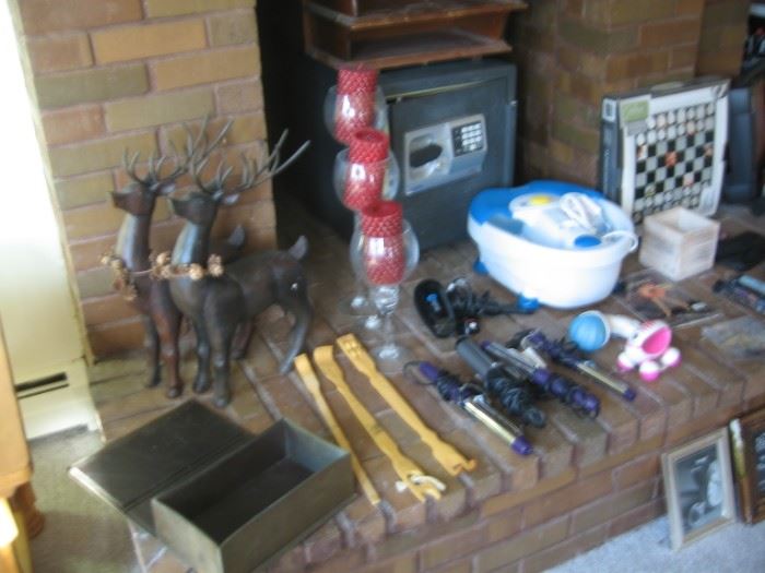 Wooden carved deer, back scratches, curling irons, hair dryer, glass candle set, wooden file holder, fireproof safe, new foot massager,  two new body massagers, wooden box, chess set.