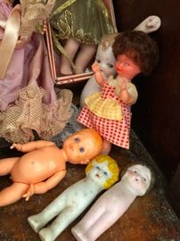 WHAT'RE THOSE? Armless porcelain dolls? Doll sticks?
