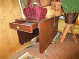 Drop-leaf table, small drawer and claw feet