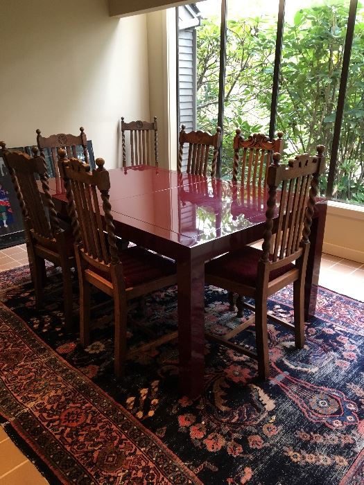 Beautiful custom dining table with antique chairs.  Dining table is finished in automotive paint for a high gloss finish