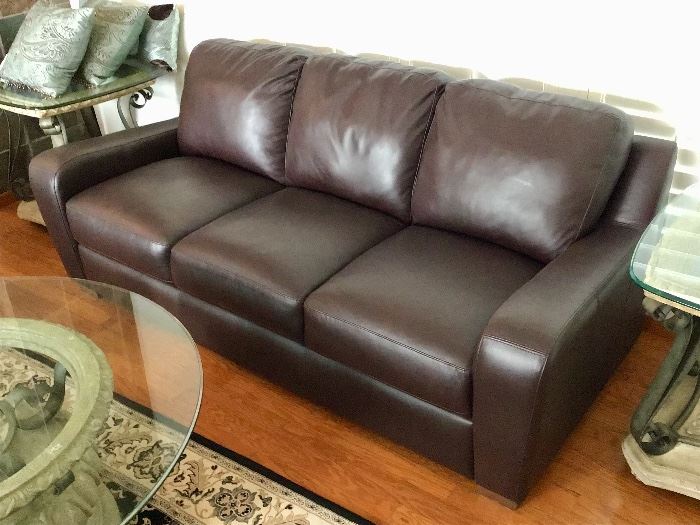 Fine Leather Château d’ Ax sofa has two matching leather armchairs.

Originally over $3,000