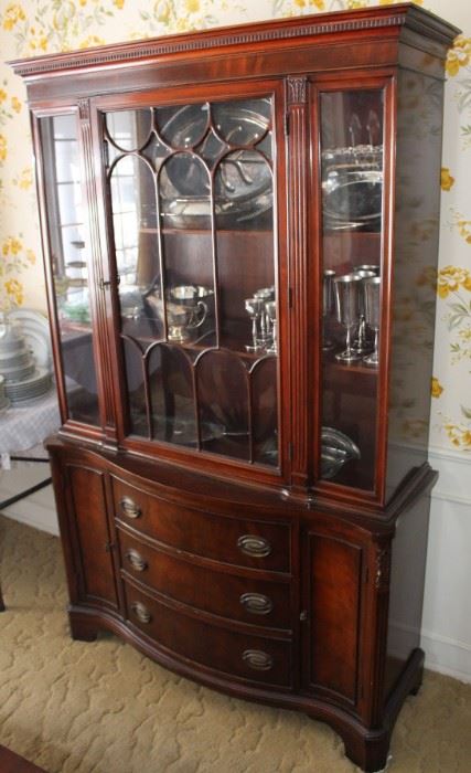 Mahogany china/display cabinet filled with silverplate items.  