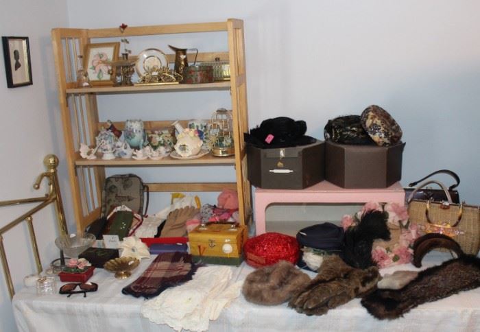 Lots of old china pieces and vintage hats and gloves.
