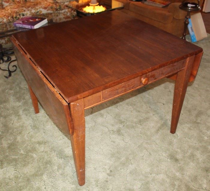 Drop leaf table with drawer.  