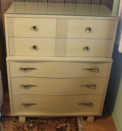 Blonde chest of drawers.