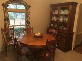 Wooden dining table, great hutch.
