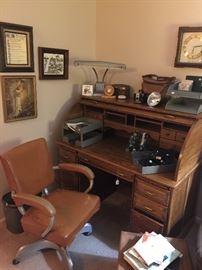 roll top desk, leather office chair, vintage lamp, office supplies, cameras