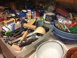 Lots of utensils and cooking supplies.
