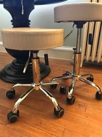 pair of vinyl covered stools on wheels.  not really used, original manufacturer's tags still attached