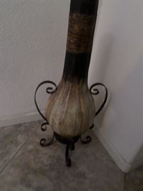 Decorative vase in iron holder