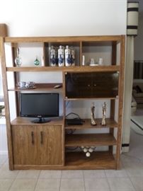 Double bookshelf, deflt decanters, small flat screen T.V. with remote