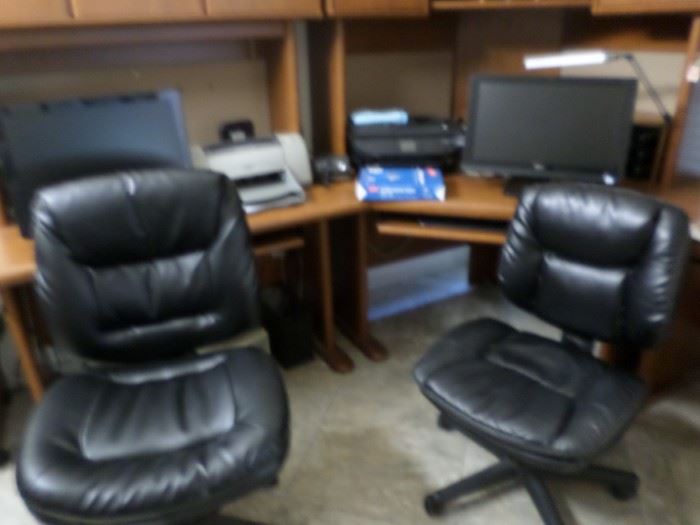 2 office chairs, 1 smaller than the other ( his and hers)