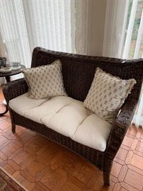 Wicker love seat with custom down pillows