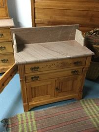 Eastlake spoon carved wash stand with marble top and backsplash 