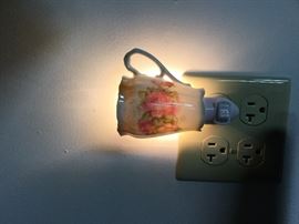 Vintage teacup nightlight has been given a second purpose by our local artist