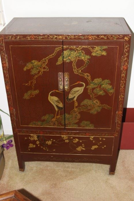 Two door Asian cabinet with shelves.