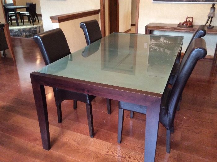 Glass top dining table and leather chairs