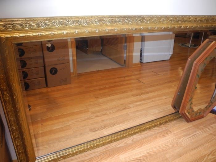 Very large gilded mirror