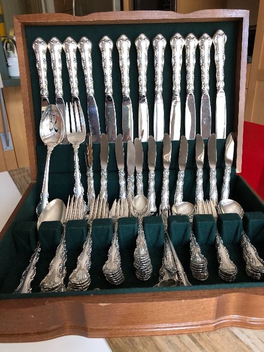 Sterling flatware for 12 by Reed and Barton “Florentine Lace.”