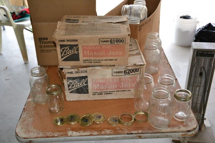 Several boxes of Ball mason jars and assorted mason jars.  Some lids.