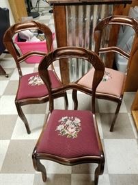 Set of four (one chair not pictured) Balloon back Victorian walnut side chairs with needlepoint seats
