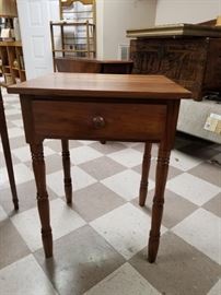 One of a pair of walnut turned leg tables