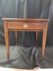 One of a pair of Davis Cabinet Company cherry side tables