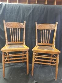 2 of a set of four of oak pressed back chairs
