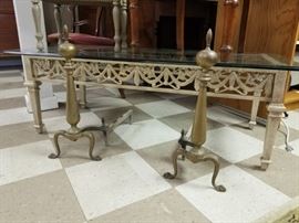 coffee table with glass top and pair of brass andirons