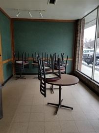 Assorted laminate top round tables with heavy metal pedestal bases $50 each (4) 34" (1) 30" Black metal ladder back chairs with burgundy vinyl seats $45 per chair (10) available