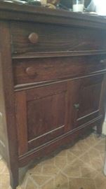 An antique oak wash stand.