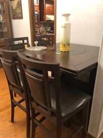 bistro dining set w/ lazy susan  in middle- has 2 swivel stools and 2 regular- they look the same -just 2 swivel 