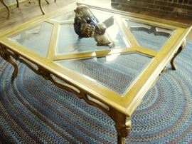 Glass top coffee table, round braided rug
