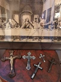 Religious items including crucifixes, scapulars, framed print of The Last Supper