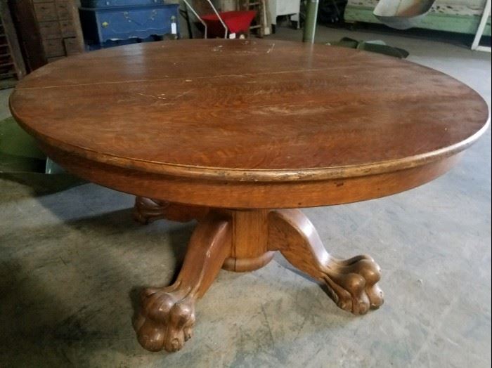 Large round table with huge claw feet
