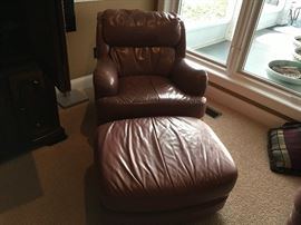 2 leather chairs and ottamans