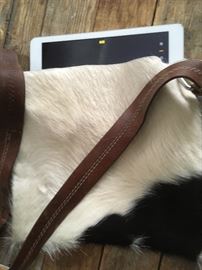 Cool cow iPad messenger bag with repurposed leather strap and hardware. A portion of the proceeds go to an Evanston scholar. $117 