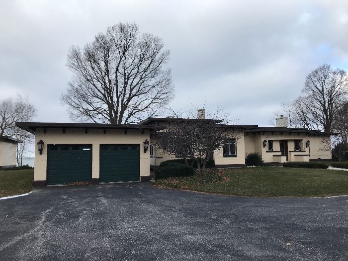 Front view of this Lake Michigan home - all doors & windows for sale, including Garage doors and openers. Outdoor lighting NOT being sold. Buyers responsible for removal.