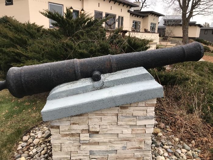 Yes salvaged cannon, set into cement on a custom stone base.   No history on it available. Buyer responsible for removal.