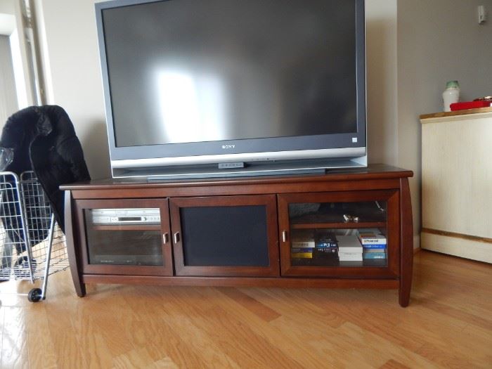 Entertainment shelf , Vhs, cd player. Large flat screen tv.