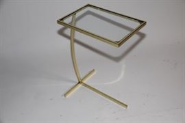 Cantilevered brass table
