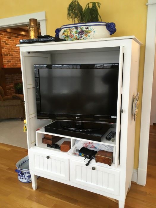 Flat screen TV for sale, as is entertainment cabinet