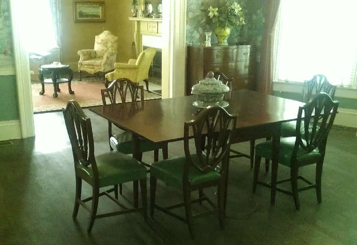 Amazing Early American Dining Rooms Set is a show stopper!  You get the table, 2 banquettes, and 10 chairs- 2 are captains chairs.  This is a 5 figure piece, but still quite a deal.  Solid- no veneer here. Lovely little details everywhere.  Most likely the finest of the day available due to the familys prominence.  Serious inquiries only please on this one.