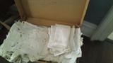 Lots of beautiful linens, doiles, and tablecloths