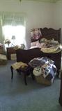 Sweet childrens room with several chest and lovely bed. Also vintage childrens clothing, quilts, and more.