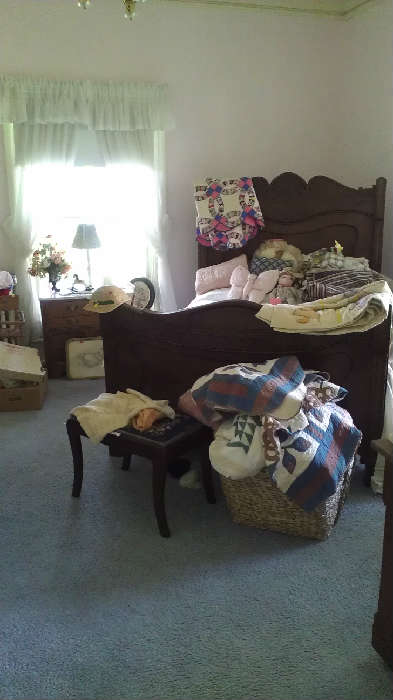 Sweet childrens room with several chest and lovely bed.  Also vintage childrens clothing, quilts, and more.
