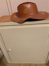leather hat, small cabinet