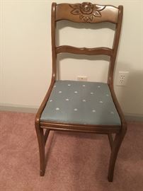 Another of the upholstered rosewood chairs