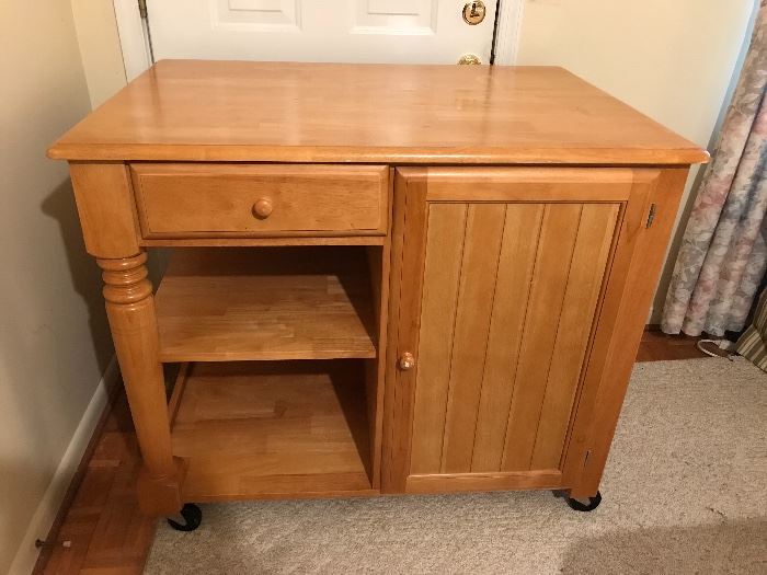 Rolling kitchen cabinet with door and drawer on both sides