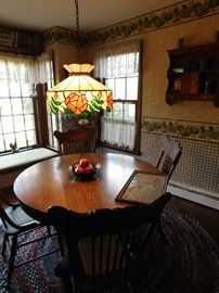 circular table with pedestal for (4) with leaves